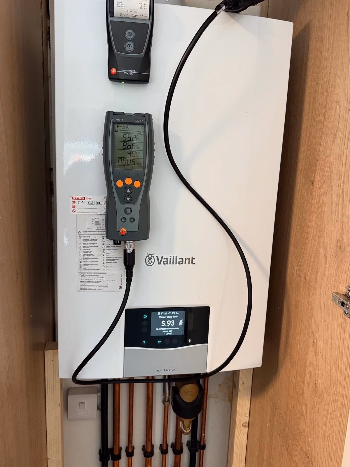 Flue gas analyser connected to a Vaillant combi boiler during a service